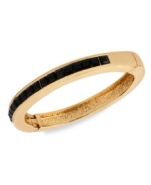 Understated elegance. This bracelet from Kenneth Cole New York is crafted from gold-tone mixed metal, with jet-colored accents giving it a formal feel. Approximate diameter: 2-1/4 inches.