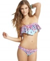 Fabulously feminine, this floral-printed Bikini Lab bandeau top features ruffle trim and a draped overlay that's oh-so flirty!