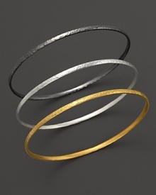 Three arresting tones, three beautiful bangles from Gurhan, crafted in hammered 24 Kt. yellow gold, white silver and dark silver.