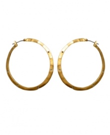 Hammered hoops make every day edgier. Kenneth Cole New York reinvents a classic with iridescent goldtone mixed metal and crystal accents. Approximate diameter: 3/4 inch.