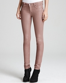 Glossy HELMUT skinny jeans shine the spotlight on your directional style sense for a dose of downtown attitude.