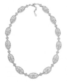 A sparkling sensation with a vintage aesthetic. Eliot Danori's elegant oval-shaped collar necklace features an ornate link pattern decorated with round-cut cubic zirconias (1 ct. t.w.) and sparkling crystals. Set in silver tone mixed metal. Approximate length: 16 inches + 2-inch extender.