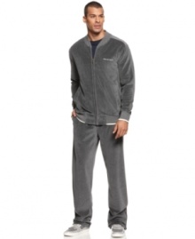 Made from soft fleece, this velour track suit by Sean John will have you chilling in serious style.