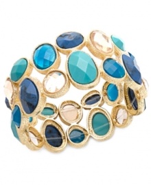 Cool off in a mixture of blue hues. Charter Club's trendy cuff bracelet is adorned with sparkling and matte epoxy beads in a range of blues from turquoise to cobalt. Crafted in gold tone mixed metal. Bracelet stretches to fit wrist. Approximate diameter: 2-1/2 inches.