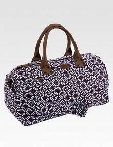 A graphic floral pattern is both sweet and sophisticated, printed on sturdy cotton in a roomy duffel.Top zip closureLeather double handlesDetachable, adjustable shoulder strapInside and outside zip pockets18¾L X 9½H X 9¼DCottonSpot cleanImported