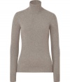 Dream sweater for fall and winter, this stone-grey cashmere sweater can be worn for almost every occasion - Feminine turtleneck flatters the figure, creating a clean silhouette - Long sleeves and a wide, moderately-long hem - An indispensable basic, it pairs nicely with jeans or corduroy pants for leisure, or with a pencil skirt and trousers at the office