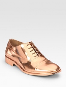 Traditional oxford silhouette enhanced by dazzling metallic leather. Metallic leather upperLeather lining and solePadded insoleMade in ItalyOUR FIT MODEL RECOMMENDS ordering one half size up as this style runs small. 