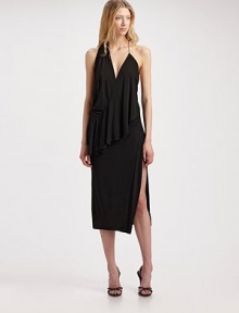 Sumptuous jersey drapes elegantly around the body in this stunning asymmetric design, finished with a plunging open-back.Crossover V neckline Sleeveless Ruffled overlay drapes asymmetrically from front to back Tapered skirt with side slit V back with single strap About 34 from natural waist Viscose Dry clean Imported