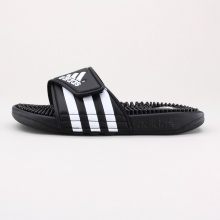 The kids' adissage Slides by adidas take all the plush comfort of the adult slide and size it down for kids. They have the easy on-and-off synthetic strap and the TPR footbed with toe-tantalizing massage nubs. Imported.