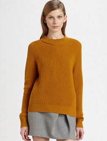 Ribbed, feather-light merino wool pullover hits below the hips and has a peeled-back neckline. Peeled roundneckLong sleevesLonger length hits below the hipsMerino woolDry cleanImportedModel shown is 5'10 (177cm) wearing US size Small.