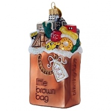 Fill 'er up! Everyone loves our iconic Little Brown Bag. Now you can put it on the tree. Hand-painted from blown glass, this ornament is a great reminder to shop for all your goodies at Bloomingdale's.