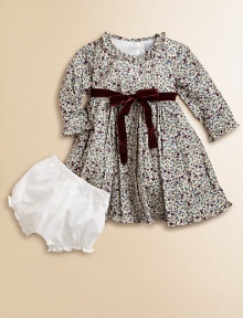 Blooming with a vivid floral print and a velvet tie, this delightful cotton frock with matching bloomers will make your little one feel like a flower girl.Ruffled round necklineLong sleevesBack buttonsWaistband with velvet ribbon tieFull skirtFully linedCottonMachine washImported Please note: Number of buttons may vary depending on size ordered. 