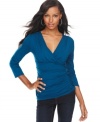 A basic knit top gets revamped with a flattering surplice neckline and ruching at the bodice in this chic look from INC.