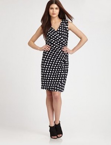 Bold polka dots decorate this flattering, form-fitting design.Surplice necklineSleevelessRuched sideTulip hemlineBack ruchingConcealed back zipFully linedAbout 22 from natural waist95% rayon/5% spandexDry cleanImportedModel shown is 5'10 (177cm) wearing US size 4. 