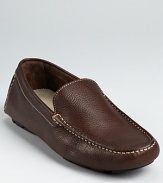 Moc toe loafer crafted in pebbled Italian leather and accented with contrast topstitching.