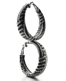 Practice contrast. A striking design made from braided black and white plastic vinyl make these Style&co. hoop earrings a fashionista's fave. Setting and lever clasp crafted in mixed metal. Approximate diameter: 2-1/2 inches.