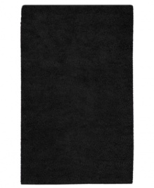 Nothing creates a more luxurious foundation than a rich, felted wool rug in sophisticated black. This plush piece features an undeniably soft hand, created with the finest hand-woven New Zealand wool.