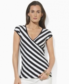 Lauren by Ralph Lauren's flattering faux-wrap top is crafted in sleek stretch jersey and finished in a bold striped pattern for modern appeal.