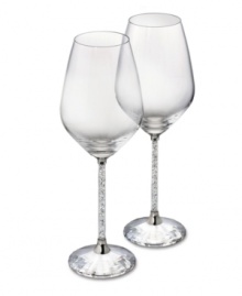 Add a touch of brilliant sparkle to your entertaining style with this set of white wine glasses. Shown at left. The bowls' classic lines and stems filled with glimmering Swarovski crystals combine for a sophisticated sensibility. Each measures 8-1/3 H x 2-7/8 D.