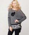 Contrasting knit stitching adds on-trend texture to this Free People sweater for a cool crafted appeal!