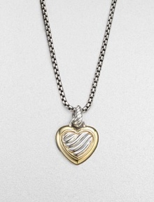 A cabled heart, gracefully framed in 18k gold with a cable bale, hangs from a bold signature chain. Sterling silver and 18k yellow gold Chain length adjusts from about 16 to 18 Pendant length, about ½ Lobster clasp Imported