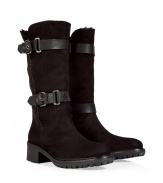 Up the style quotient of your cold weather look with these rugged-luxe shearling boots from Rossano Bisconti - Round toe, chunky sole and block heel, supple suede, mid-shaft length, dual buckle and strap detail, shearling lining - Pair with pleated wool short with ribbed tights and an oversized cashmere sweater