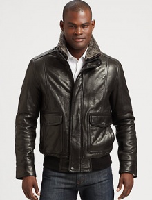 This classic bomber style is perfect for any occasion, shaped in supple leather with a removable genuine dyed shearling collar for the ultimate experience of warmth and comfort.Zip frontButtoned placketWaist flap pocketsRibbed knit hemFully linedAbout 27 from shoulder to hem LeatherDry cleanImportedFur origin: Portugal