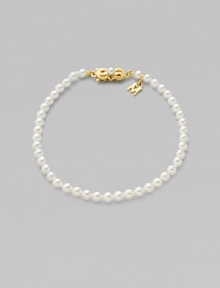 A strand of white cultured pearls with signature clasp closure.4mm white cultured pearls 18K yellow gold Length, about 7 Minuette clasp closure Imported 