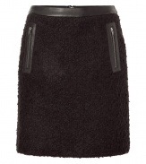 Stylish skirt in fine black arcylic-wool blend, with a hint of stretch - Fashionable leather trim at waist, and side zip pockets - Short mini-length - Fun piece for fall and winter with blouses, turtlenecks and sweaters - Try with opaque tights and ankle boots