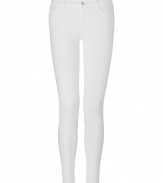 A tried and true favorite of the fashion set detailed in pristine white, these J Brand jeans are easy and flattering with a skinny leg and just the right amount of stretch - Classic five-pocket style, zip fly, button closure, belt loops - Slim fit - Wear with a pullover, leather jacket, and flats