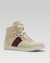 A lace-up, high-top silhouette crafted in supple suede with signature stripes and shearling lining.Lace-upSuede upperShearling liningRubber solePadded insoleMade in Italy