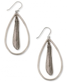 Your new fine feathered friends. These hoop earrings from Lucky Brand are styled in an oblong design with a feather pendant at the center. Crafted in silver tone mixed metal. Approximate drop: 2-1/4 inches.