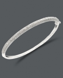 Slip a little luster over your wrist. This sparkling bangle by Victoria Townsend features a smooth sterling silver setting decorated with round-cut diamonds (1/4 ct. t.w.). Approximate diameter: 2-1/2 inches.