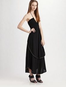 Luxuriously draped jersey in an ultra-feminine halter silhouette, ruched at the bodice and finished with contrast piping at the skirt.Halter top V neckline Ruched bodice Slightly gathered skirt Shirttail hem About 37 from natural waist 72% acetate/24% nylon/4% spandex Dry clean Imported