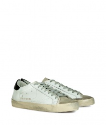 Luxe with a retro edge, these sneakers from Golden Goose will kick your style into high gear - Round toe, lace-up style, perforated side star detail, rubber sole - Pair with jeans or cargo pants, a tee, and a leather jacket