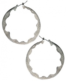 It's all about intricate touches and subtle textures. FALCHI by Falchi's exotic hoop earrings features a scalloped design in silver tone mixed metal. Approximate diameter: 1-5/8 inches.