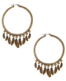 Bold, yet breezy. Lucky Brand takes a traditional pair of hoop earrings and adds a dream catcher-inspired design. Dangling feathers add a fashionable touch to a gold tone mixed metal setting. Approximate drop: 2 inches.