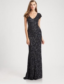 Allover beads and sequins create a dazzling effect on this festive, floor-length design.V necklineCap sleevesConcealed back zipFully linedAbout 61 from shoulder to hemNylonSpot cleanImportedModel shown is 5'11 (180cm) wearing US size 4. 