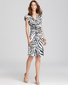 A wild zebra print takes to a tame Lafayette 148 New York sheath for a refined walk on the wild side.