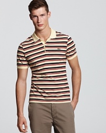 With a vibrant punch of multicolored stripes, this classic polo from Lacoste gets a stylish-yet-edgy update.