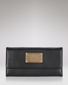 Rich leather is dressed up with a bold logo-stamped plaque in this utility chic wallet from MARC BY MARC JACOBS.