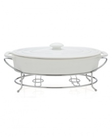 At once elegant and utilitarian, the Cucina covered baker transitions flawlessly from oven to table and will keep your food piping hot, set in a silvertone metal rack. A must for the consummate host, from Godinger.