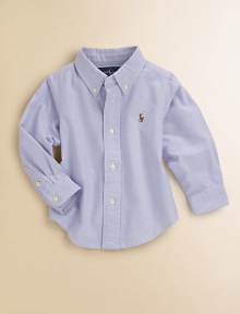 A classic button-down design is crafted in vibrant woven cotton for a clean, preppy style.Button-down collarLong sleeves with barrel cuffsButton-frontBox-pleated backShirttail hemCottonMachine washImported Please note: Number of buttons may vary depending on size ordered. 