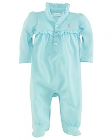 Rendered in a traditional, sporty cotton mesh, this adorable coverall is trimmed with ruffles along the collar and empire waist.