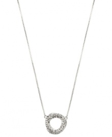 Swirling rings of crystal accents lend a mesmerizing touch to this pendant necklace from Anne Klein. Crafted in silver tone mixed metal. Approximate length: 16 inches + 2-inch extender. Approximate drop: 3/4 inch.