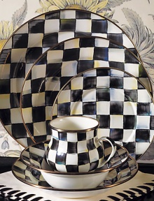 A charming way to add color and personality to the dinner table, crafted in a checkerboard juxtaposition of ivory and onyx with bronzed stainless steel trim. Enameled steel 12 diam. Dishwasher safe Made in USA 