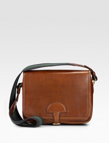 Rich saddle leather in a trim, flap bag with a sporty striped strap. Striped twill shoulder strap, 18½ drop Buckled flap closure One inside open pocket Suede lining 11½W X 8H X 4D Made in Italy