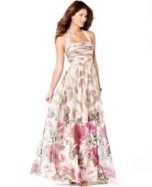 Enchanted garden: A neutral leaf print becomes a colorful poppy print at the hem of this charming evening gown by Adrianna Papell. The halter neckline and pleated bodice lend the silhouette sophistication.