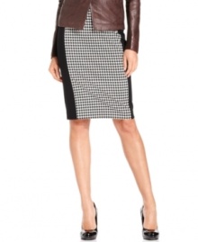 Sophisticated houndstooth alternates with solid panels to give this MICHAEL Michael Kors pencil skirt a fresh, modern feel. Classic pumps keep it polished for work while statement heels give it the right look for a night out.