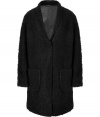 Boucle coat of a black wool blend - The cut is relaxed, with deep lapels and large patch pockets - Comfortable length to thigh - Wear with business suits, leather pants, pencil skirts, and even jeans